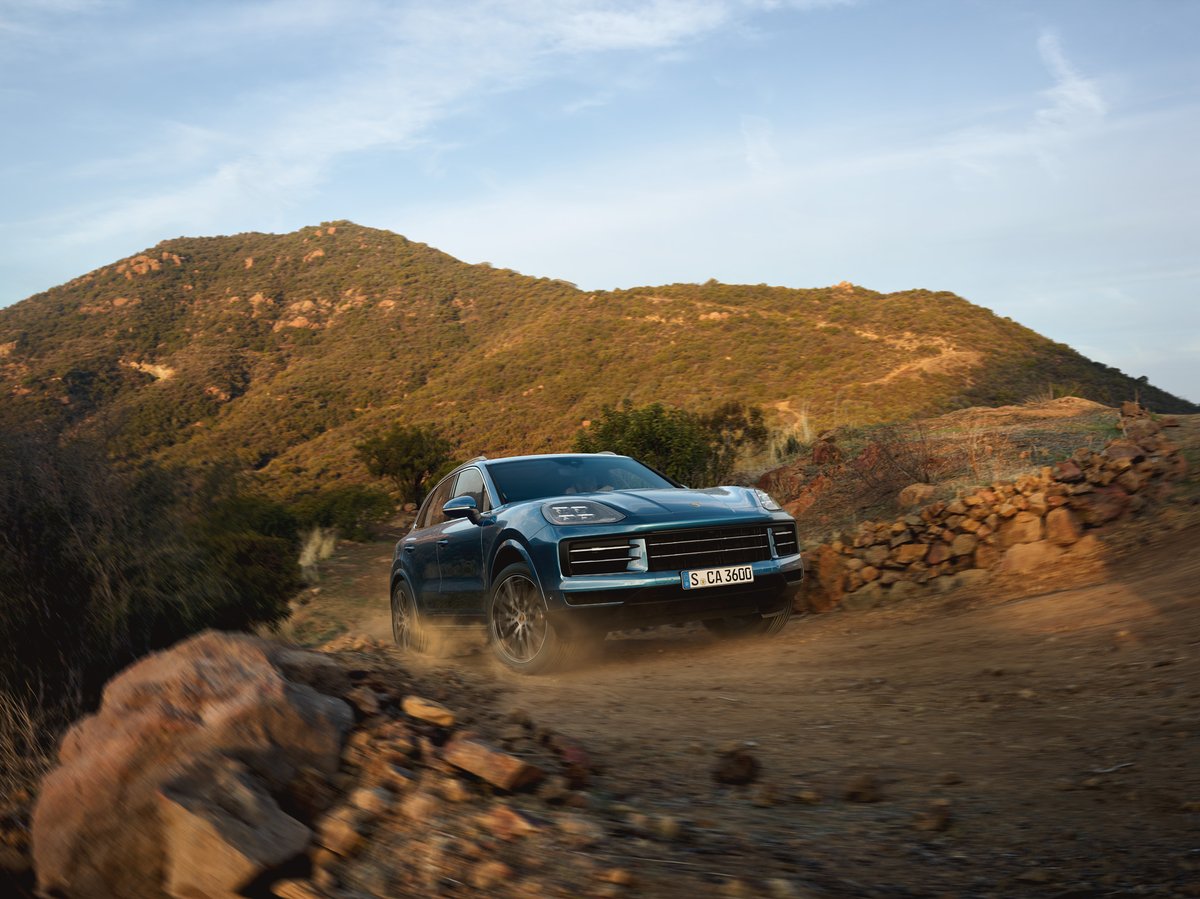 Porsche Cayenne on a gravel mountain track